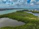 Kayakers in lush mangrove waterways near the coast at 800 S Blvd Of Presidents # 12, Sarasota, FL 34236