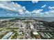 Aerial view of coastal town with beach, water, and buildings at 800 S Blvd Of Presidents # 12, Sarasota, FL 34236