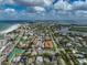 Aerial view of coastal neighborhood near beach, featuring various homes and waterways at 800 S Blvd Of Presidents # 12, Sarasota, FL 34236
