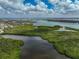 Aerial view of waterfront property with lush mangroves and kayaks at 800 S Blvd Of Presidents # 12, Sarasota, FL 34236
