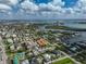 Aerial view of coastal neighborhood near beach, featuring various homes and waterways at 800 S Blvd Of Presidents # 12, Sarasota, FL 34236