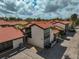 Aerial view of condo building with red tile roof and parking at 800 S Blvd Of Presidents # 12, Sarasota, FL 34236