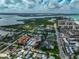 Aerial view of coastal neighborhood near beach, featuring various homes and waterways at 800 S Blvd Of Presidents # 12, Sarasota, FL 34236