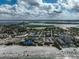Aerial view of coastline, beach, and residential area at 800 S Blvd Of Presidents # 12, Sarasota, FL 34236