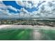 Aerial view of beach and coastline, showcasing beautiful turquoise water and white sand at 800 S Blvd Of Presidents # 12, Sarasota, FL 34236
