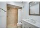 Updated bathroom with walk-in shower and white vanity at 800 S Blvd Of Presidents # 12, Sarasota, FL 34236