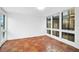Bright bedroom with tile floors and large windows at 800 S Blvd Of Presidents # 12, Sarasota, FL 34236