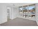 Bright bedroom with large windows and en-suite bathroom at 800 S Blvd Of Presidents # 12, Sarasota, FL 34236