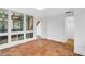 Well-lit bedroom with tile floors and multiple windows at 800 S Blvd Of Presidents # 12, Sarasota, FL 34236