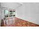 Bright dining area with tile floors and large windows at 800 S Blvd Of Presidents # 12, Sarasota, FL 34236