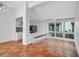 Open concept kitchen with breakfast bar and terracotta tile floor at 800 S Blvd Of Presidents # 12, Sarasota, FL 34236