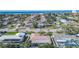 Aerial view of a house near the beach, showcasing ocean views and surrounding homes at 829 Harbor S Dr, Venice, FL 34285