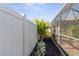 Landscaped backyard with privacy fence and mature plants at 829 Harbor S Dr, Venice, FL 34285