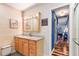 Updated bathroom with light wood vanity, marble countertop, and shiplap walls at 829 Harbor S Dr, Venice, FL 34285