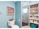 Bathroom with toilet, glass shower, and open shelving at 829 Harbor S Dr, Venice, FL 34285