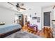 Bedroom with wood floors, ceiling fan and walk-in closet at 829 Harbor S Dr, Venice, FL 34285