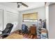 Home office with wood floors, built-in closet, and office chair at 829 Harbor S Dr, Venice, FL 34285