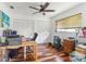Home office with wood floors, built-in closet, and a work desk at 829 Harbor S Dr, Venice, FL 34285
