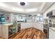 Modern kitchen with white cabinets, stainless steel appliances, and a large island at 829 Harbor S Dr, Venice, FL 34285
