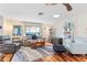 Relaxing living room featuring hardwood floors, comfortable seating, and natural light at 829 Harbor S Dr, Venice, FL 34285
