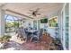Brick patio with outdoor dining set and ceiling fan at 829 Harbor S Dr, Venice, FL 34285