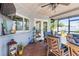 Outdoor patio with dining table, seating and ceiling fan at 829 Harbor S Dr, Venice, FL 34285