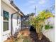 Landscaped side yard with path and shed at 829 Harbor S Dr, Venice, FL 34285