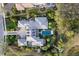 Stunning aerial view of estate featuring private pool, well-maintained grounds and circular driveway at 8388 Catamaran Cir, Lakewood Ranch, FL 34202