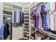 Well-organized walk-in closet with ample shelving, hanging space, and storage for shoes and accessories at 8388 Catamaran Cir, Lakewood Ranch, FL 34202