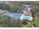 Community pool and tennis courts, perfect for recreation at 8469 Cypress Lake Cir, Sarasota, FL 34243