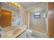 Clean bathroom with tub shower, vanity, and updated fixtures at 8469 Cypress Lake Cir, Sarasota, FL 34243