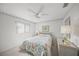 Guest bedroom with ceiling fan, double bed and built-in closet at 8469 Cypress Lake Cir, Sarasota, FL 34243