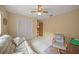 Bright bedroom featuring a large closet and sitting area at 8469 Cypress Lake Cir, Sarasota, FL 34243