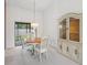 Dining room with chandelier, and wooden dining set at 8469 Cypress Lake Cir, Sarasota, FL 34243