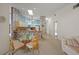 Kitchen with a breakfast bar, and light-colored cabinets at 8469 Cypress Lake Cir, Sarasota, FL 34243