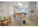 Galley kitchen with wood countertops and white appliances at 8469 Cypress Lake Cir, Sarasota, FL 34243