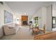Living room boasts a cozy fireplace and adjacent dining area at 8469 Cypress Lake Cir, Sarasota, FL 34243