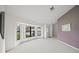 Living room with wall-to-wall carpeting and bay window at 8469 Cypress Lake Cir, Sarasota, FL 34243