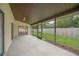 Spacious screened patio overlooking a fenced backyard at 8469 Cypress Lake Cir, Sarasota, FL 34243