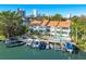 Aerial view of waterfront property with boat slips and a community pool at 866 Hudson Ave # 866, Sarasota, FL 34236