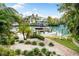 Private boat dock with lift and lush landscaping, providing direct water access at 866 Hudson Ave # 866, Sarasota, FL 34236