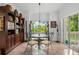 Cozy breakfast nook with a glass-top table and four chairs at 866 Hudson Ave # 866, Sarasota, FL 34236