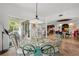 Open dining area with glass table and view of the kitchen at 866 Hudson Ave # 866, Sarasota, FL 34236