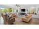 Bright living room with tiled floors, comfortable sofas, and a modern fireplace at 866 Hudson Ave # 866, Sarasota, FL 34236
