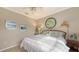 Bedroom with a king-size bed and coastal decor at 872 Clear Lake Dr, Englewood, FL 34223