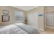 Bedroom with a king bed, window coverings, and a double door closet at 872 Clear Lake Dr, Englewood, FL 34223
