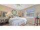Bedroom with a king-size bed and coastal decor at 872 Clear Lake Dr, Englewood, FL 34223