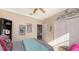 Bedroom with a queen bed, ceiling fan, and access to an office at 872 Clear Lake Dr, Englewood, FL 34223