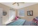 Bedroom with a queen bed, ceiling fan and double door closet at 872 Clear Lake Dr, Englewood, FL 34223