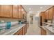Modern kitchen boasts granite countertops, stainless steel appliances, and ample cabinetry at 872 Clear Lake Dr, Englewood, FL 34223